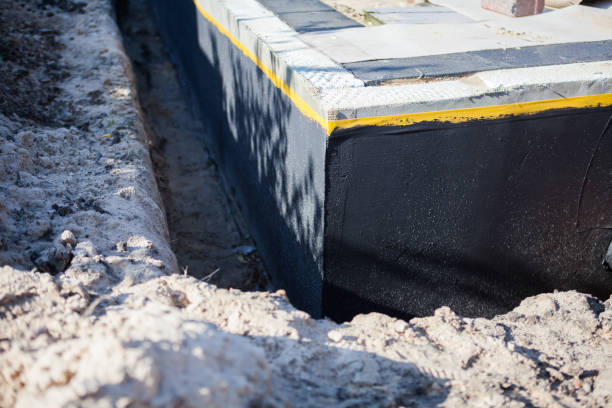 Professional Waterproofing technician working in Grosse Ile, MI